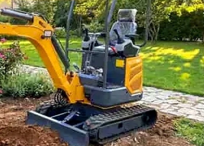 SeekMach mini excavator working near a garden path while trenching for backyard drainage