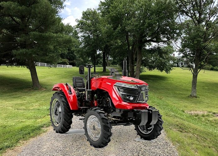 Tractor pallet forks handling fence materials Compact tractor using pallet forks to handle fence posts on rural property