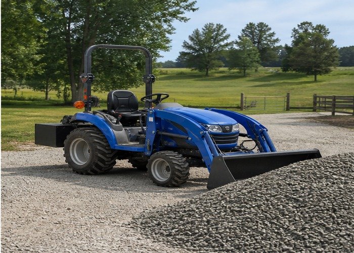 Compact tractor parked safely beside a neatly placed gravel pile Compact tractor parked safely beside a neatly placed gravel pile