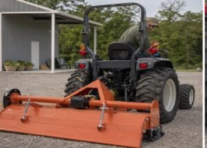 Compact tractor aligned with a rear tiller on a level equipment pad