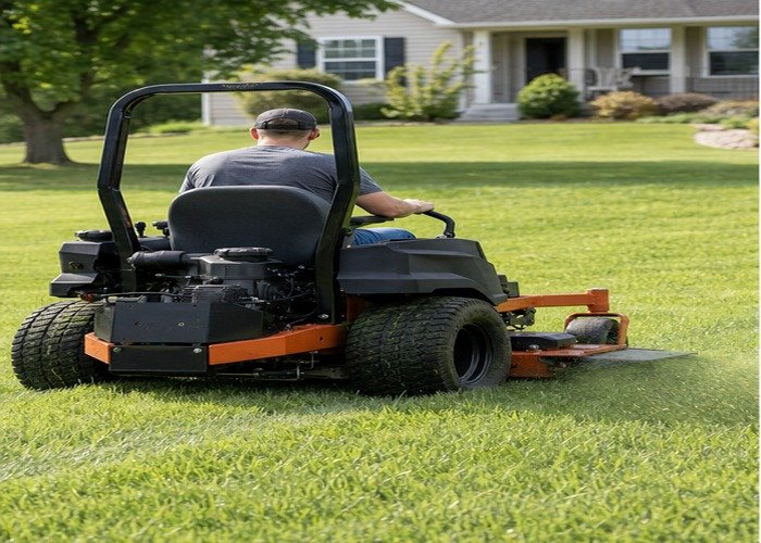 Zero-turn mower producing a clean discharge pattern on a dry lawn