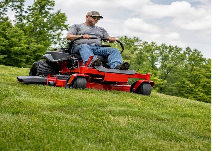 Zero-turn mower cutting an undulating lawn with the deck held clear of high spots
