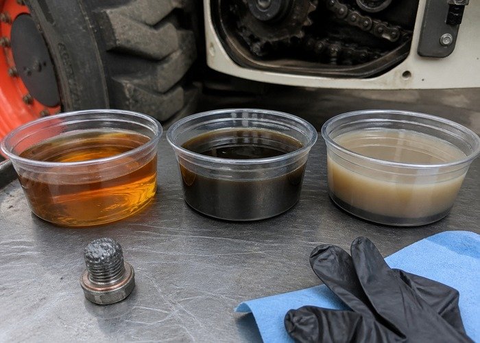 Comparing clean, water-contaminated, and metal-contaminated skid steer chaincase oil samples