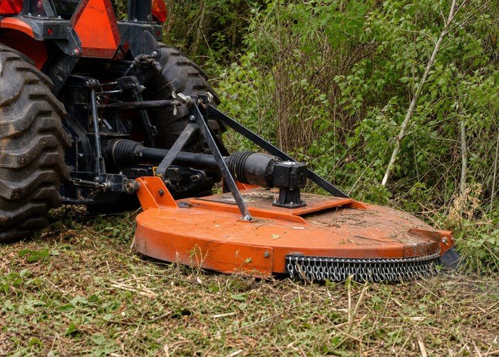 tractor vs skid steer vs mini excavator land clearing detail inspection