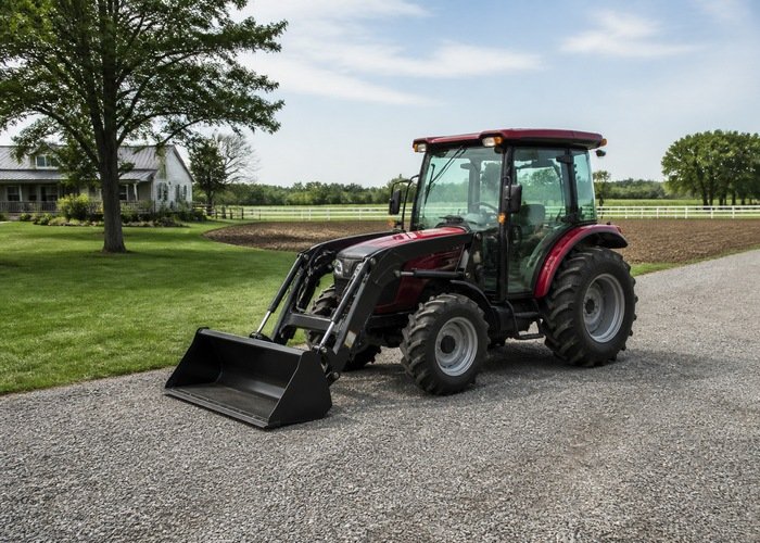 Compact tractor on lawn gravel and cultivated ground