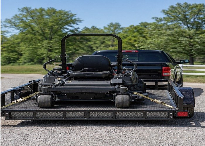 Zero-turn mower secured on a connected utility trailer Zero-turn mower secured on a connected utility trailer