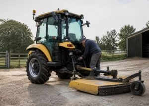 Compact tractor and rotary cutter parked for a safe PTO engagement inspection