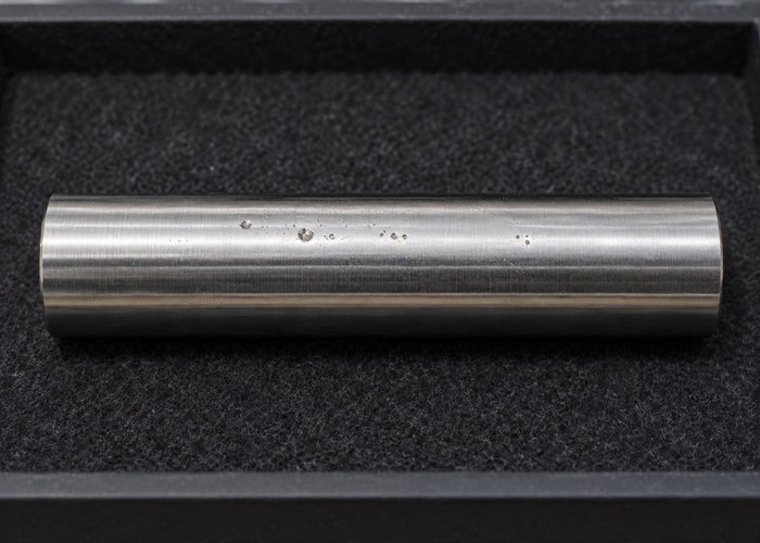 Illustrative detached polished rod sample with surface pits on inspection tray