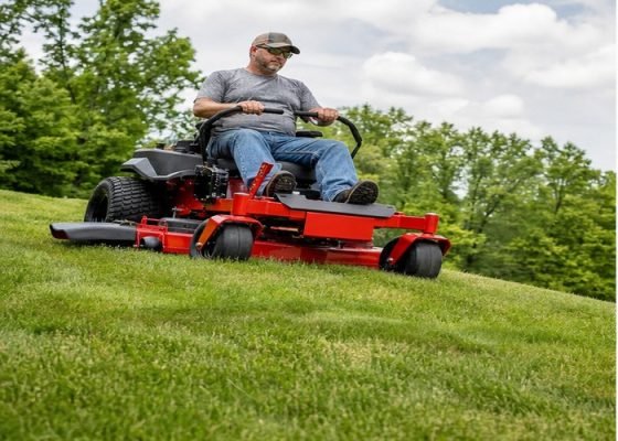 Zero-turn mower cutting an undulating lawn with the deck held clear of high spots